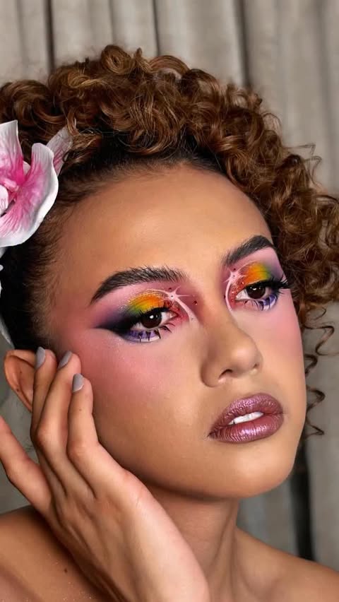 Instagram post by @emmanuelvarela_ for Docolor.Official. Caption reads: Every shade of Pride, every stroke of magic.🌈....