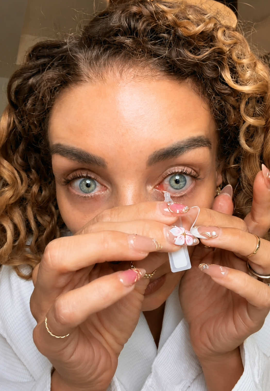 TikTok post by @jena for Lumify. Caption reads: [...] redness reliever for your eyeballs! @LUMIFY....