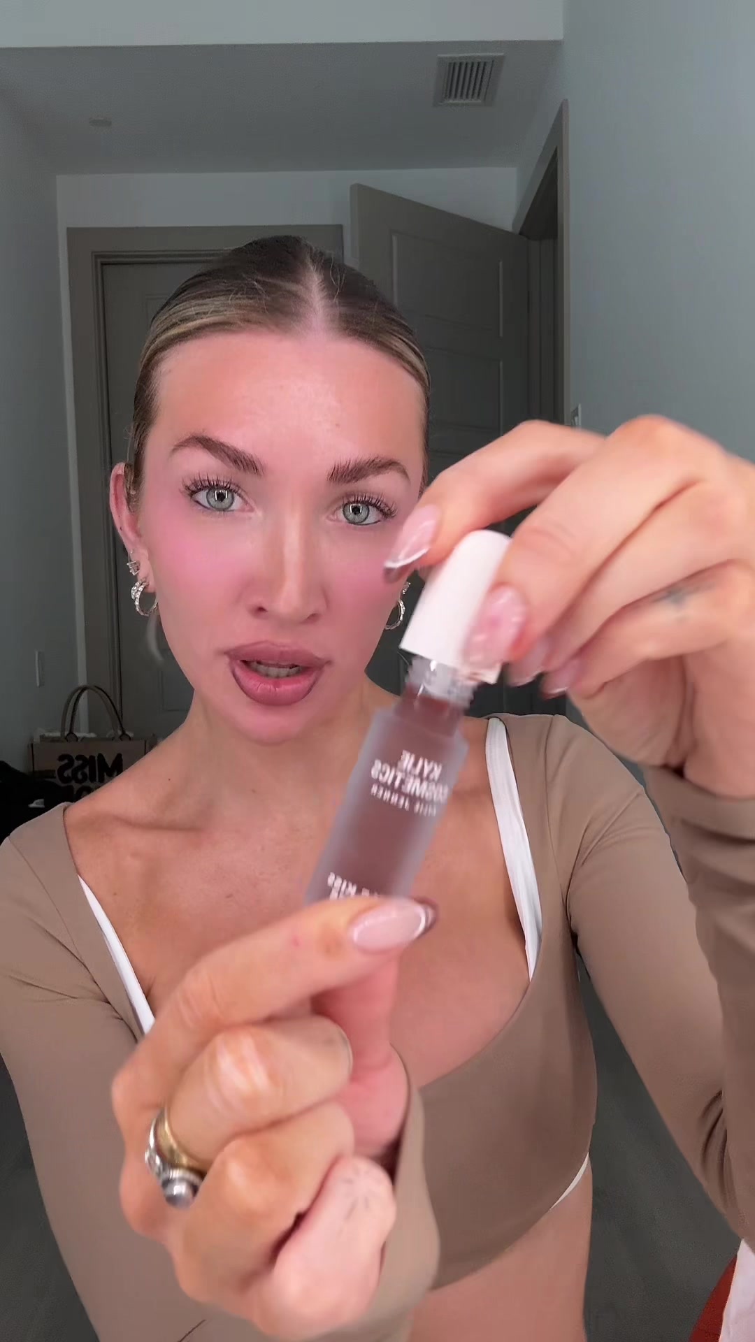 TikTok post by @kateecass for Kylie Cosmetics. Caption reads: [...] 🔓 what’s your favorite 🤎?? #KylieCosmetics....