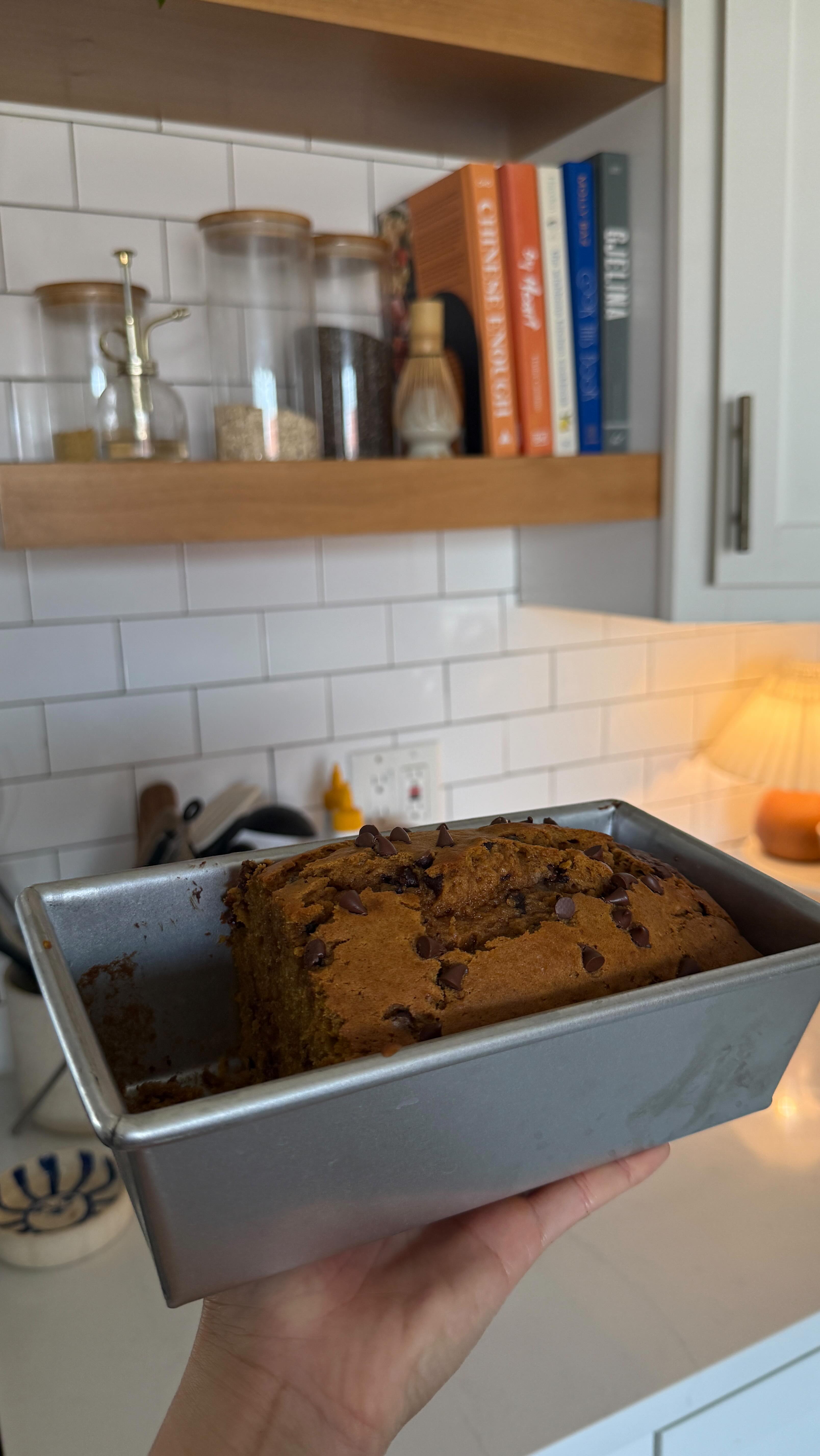 Instagram post by @the.orange.home for Nespresso. Caption reads: #ad My cozy fall duo: pumpkin flavored coffee +....