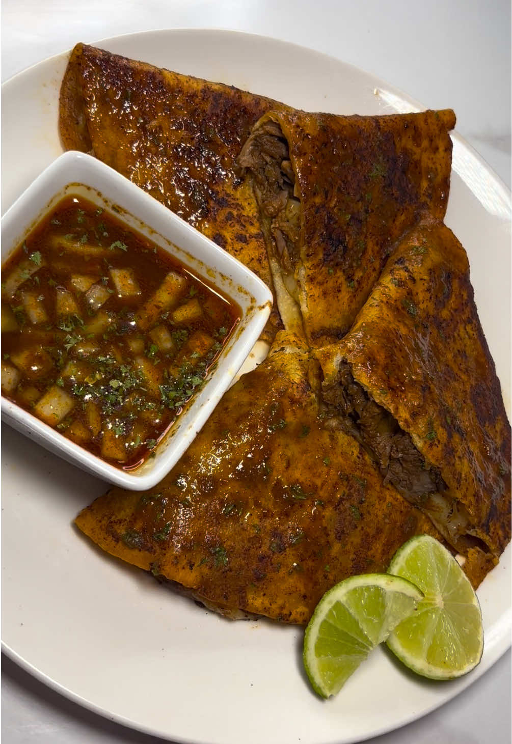 TikTok post by @deyj_loaf for EZ Bombs. Caption reads: BIRRIA TACOS 🌮 made with birria bombs from @EZ....