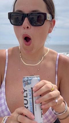 Instagram post by @katenorkeliunas for Truly Hard Seltzer. Caption reads: Truly Hard Seltzer is taking it back to Summer 16’....