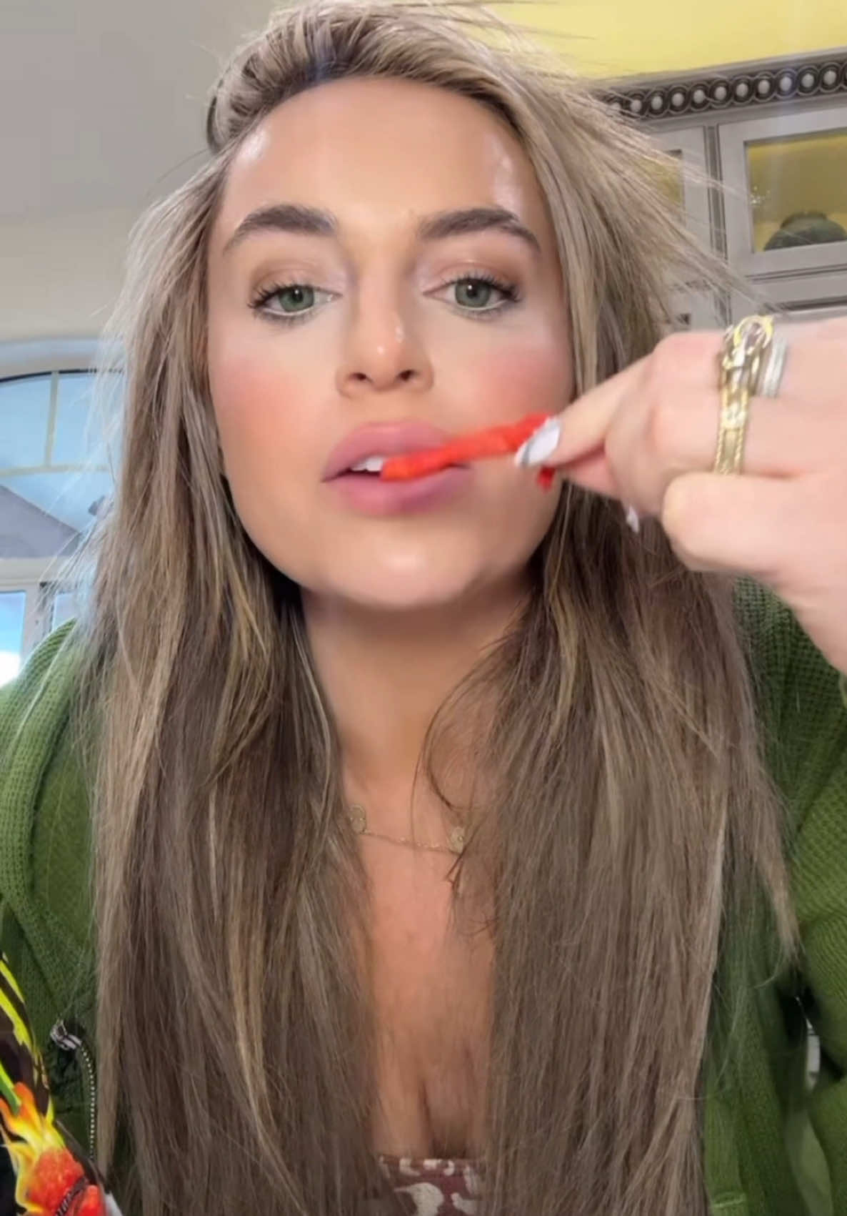 TikTok post by @alluredbeauty for FritoLay. Caption reads: DILL PICKLE HOT CHEETOS? Yes yes yes I will snatch....