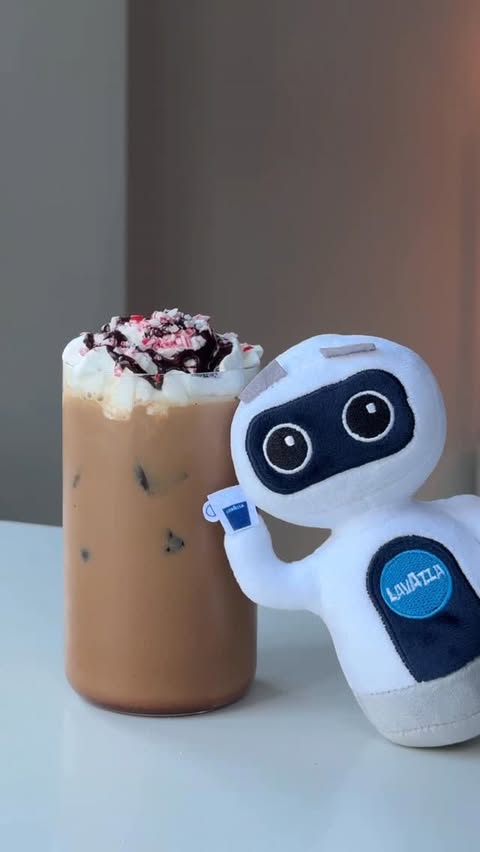 Instagram post by @coffeebae97 for Lavazza USA. Caption reads: Taking a moment of pause this holiday season with....