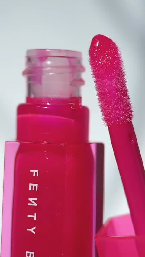 Instagram post by @fromsandyxo for FENTY BEAUTY BY RIHANNA. Caption reads: Gloss Bomb gets jelly! NEW @fentybeauty Gloss Bomb....