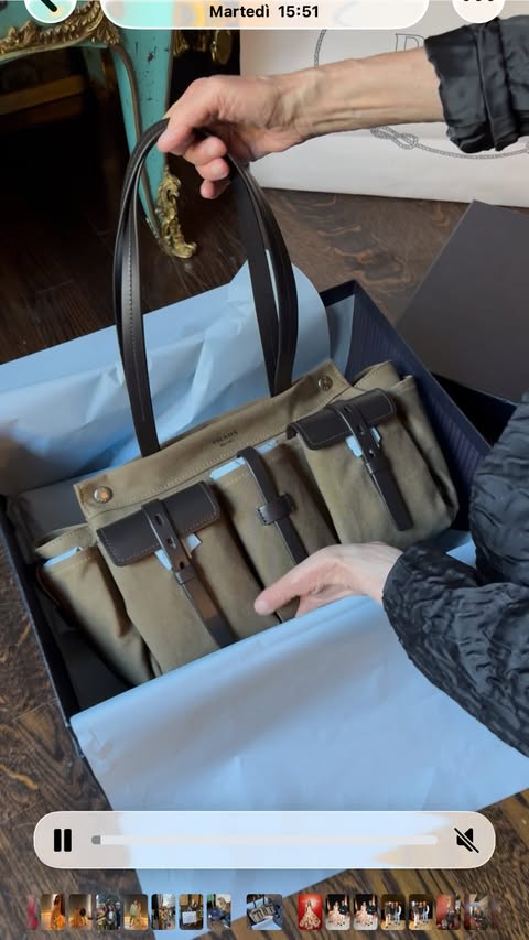 Instagram post by @annadellorusso for Prada. Caption reads: Unboxing 📦 new Route @prada bag ✈️🤍🤍🤍....