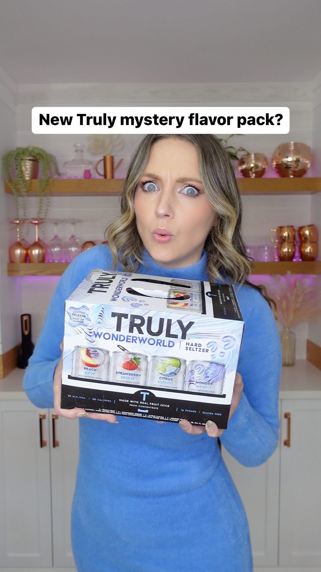 Instagram post by @lorynpowell for Truly Hard Seltzer. Caption reads: Truly’s new Wonderworld hard seltzer pack has a....