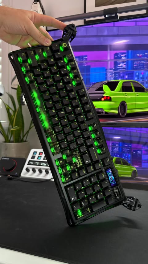Instagram post by @developeradam for GravaStar. Caption reads: New keyboard who dis 👀 Gravastar have finally....