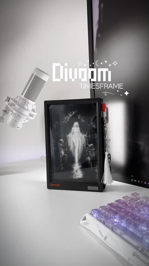 Instagram post by @jinxxd__ for Divoom. Caption reads: Divoom Times Frame ⋆˚࿔ thank you so much [...].
