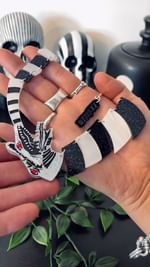 Instagram post by @roxie_enchanted_rose for Tatty Devine. Caption reads: [...] - Have you seen the Beetlejuice X....