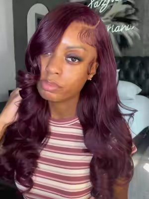 TikTok post by @_jazminbriana for Pizazz Hair. Caption reads: Pizazz black cherry body wave wig @Pizazzhairstore....