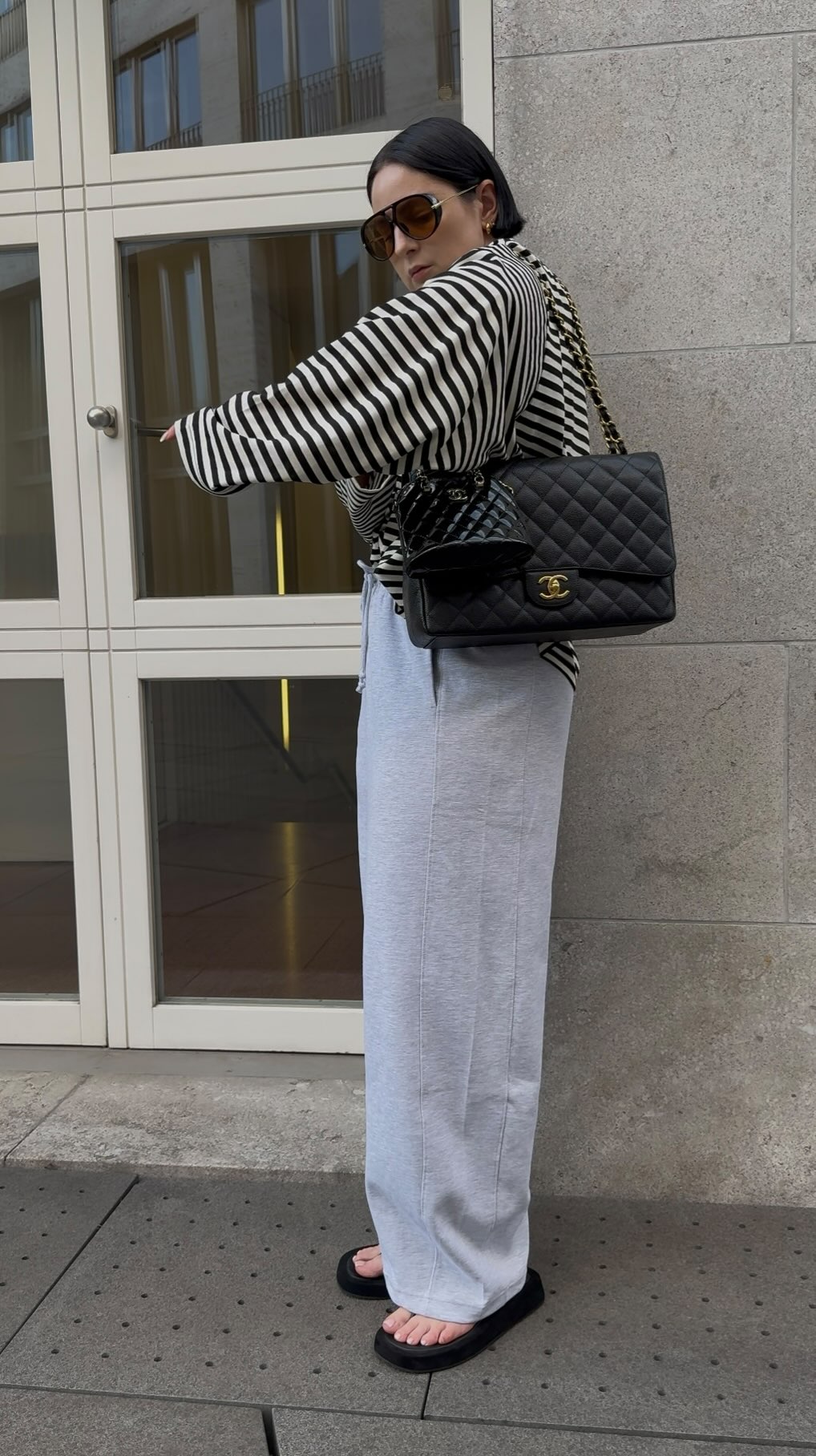 Instagram post by @fashionstylistmb for Lioness Fashion. Caption reads: ad/Werbung carry two bags at the same time....