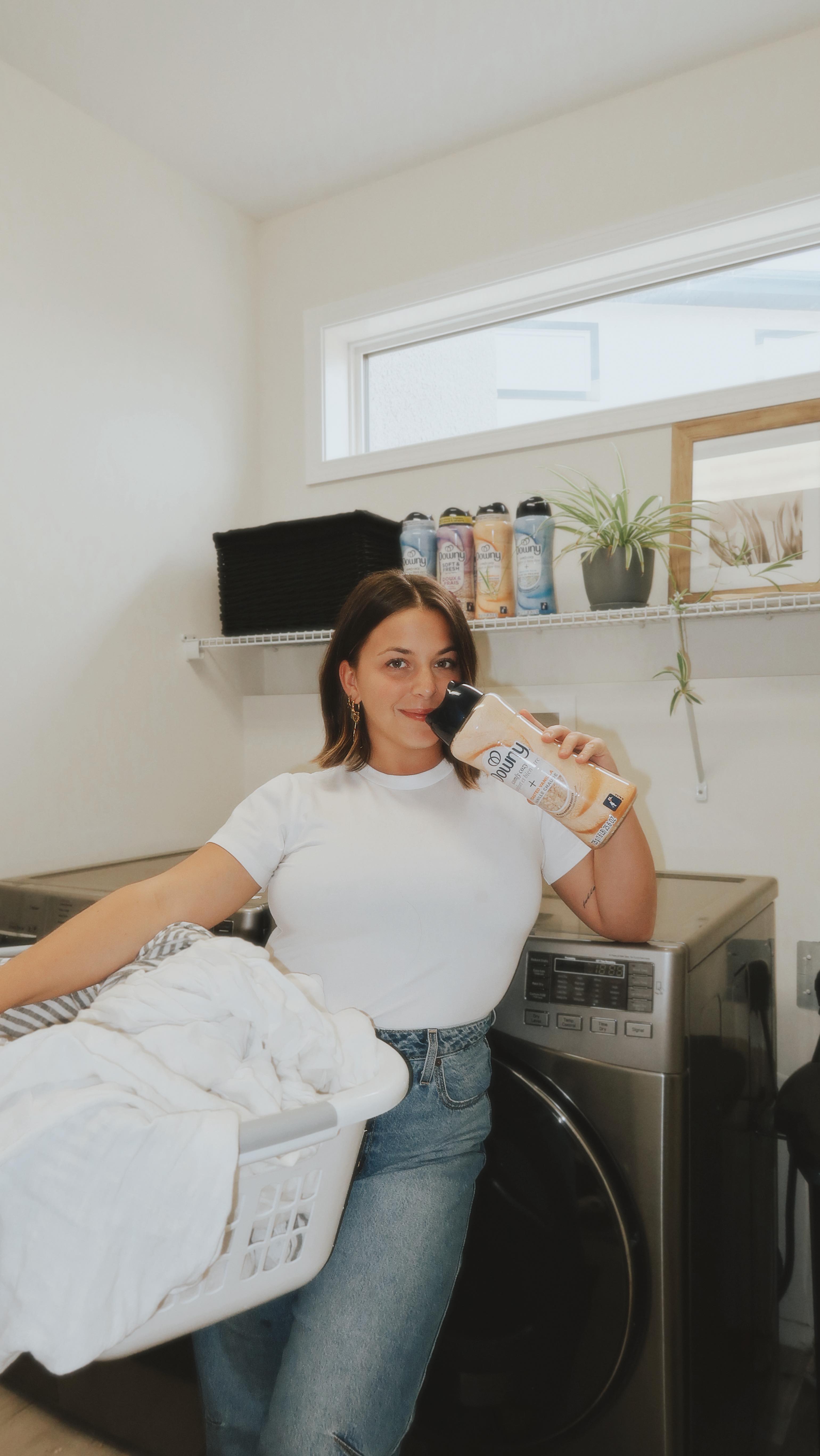 Instagram post by @nicolezaajac for downy. Caption reads: #ad When I tell you adding @downy 2-in-1 Scent....