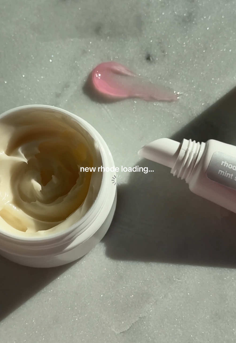 TikTok post by @222katerina for Rhode Skin. Caption reads: new @rhode skin loading… 🪽🍦✨🤍🧴 been [...].