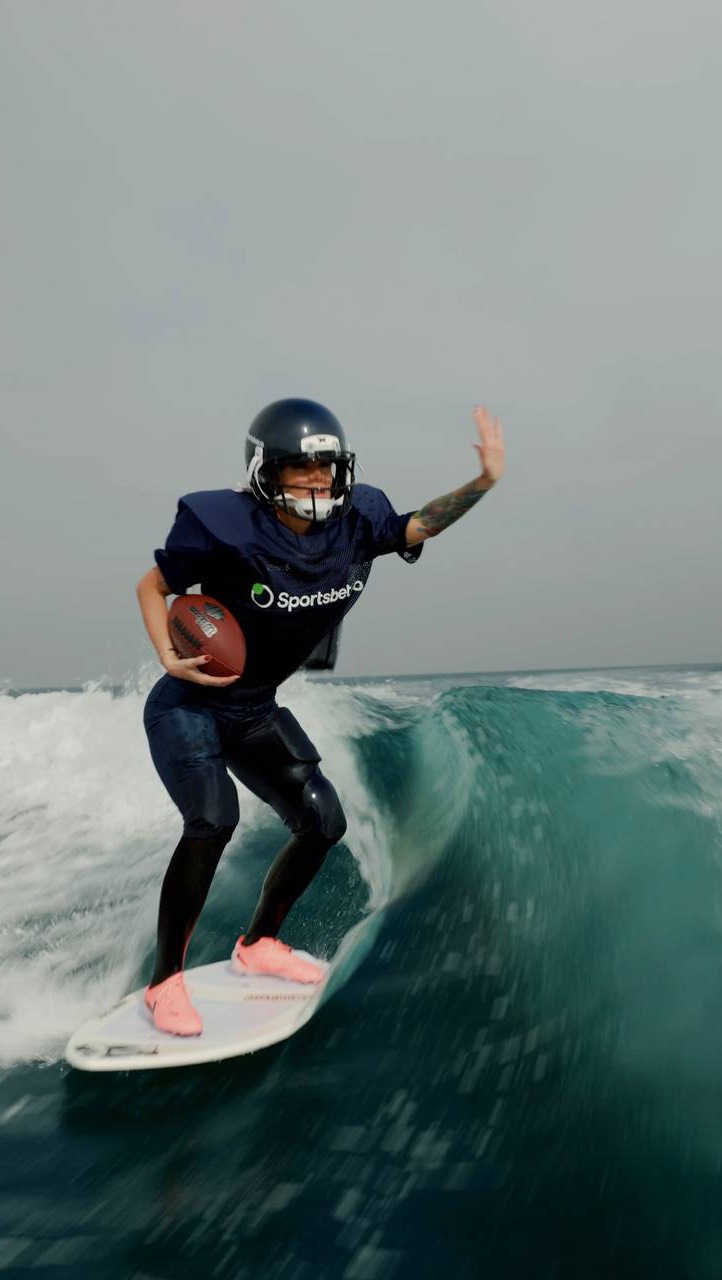 Instagram post by @boss_baby001k for Sportsbet.io. Caption reads: From waves to touchdowns 🌊🏈 @sportsbet.io 

#nfl....