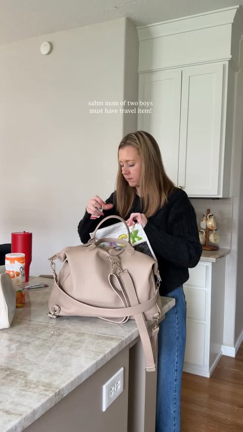 Instagram post by @emilymaeroth for Tiny Traveler. Caption reads: [...] mom must have! We are loving this....