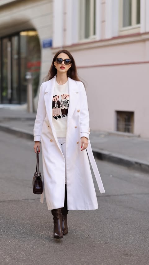 Instagram post by @ninnanatsvlishvili for JardinVue. Caption reads: Look of the day 🤍
Wearing coat @jardinvue 

Use....