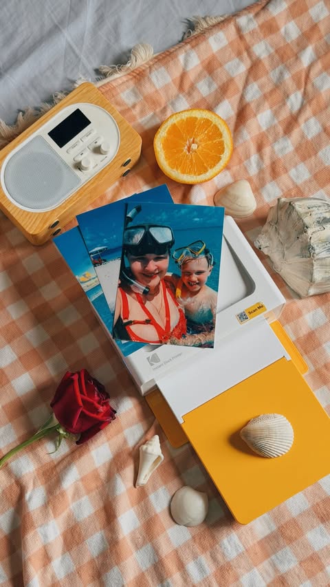Instagram post by @alyonkashe for Kodak Photo Printer. Caption reads: [...] more memories this season 🌊🍊....