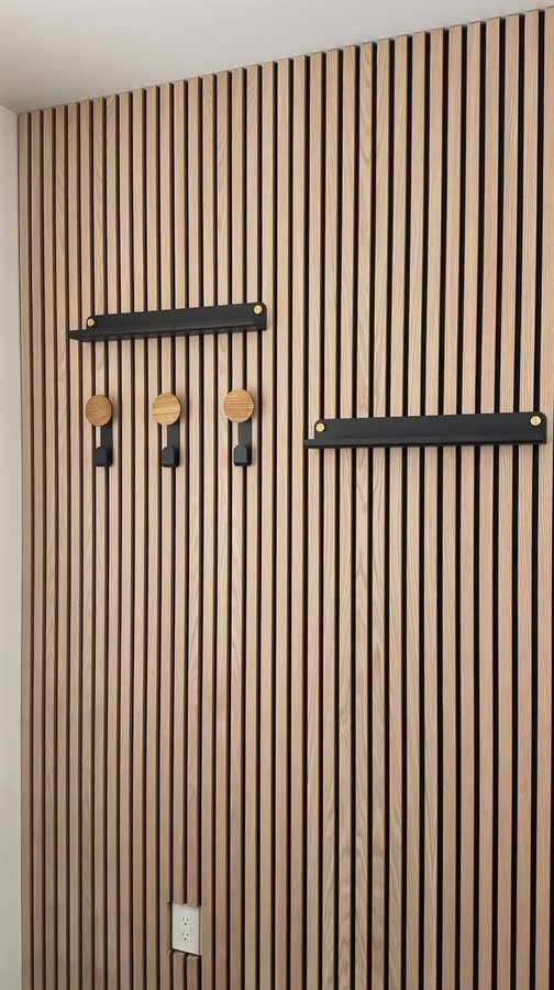 Instagram post by @stagedby.ana.egger for WoodUpp. Caption reads: No entryway? No problem! These wood up panels are....