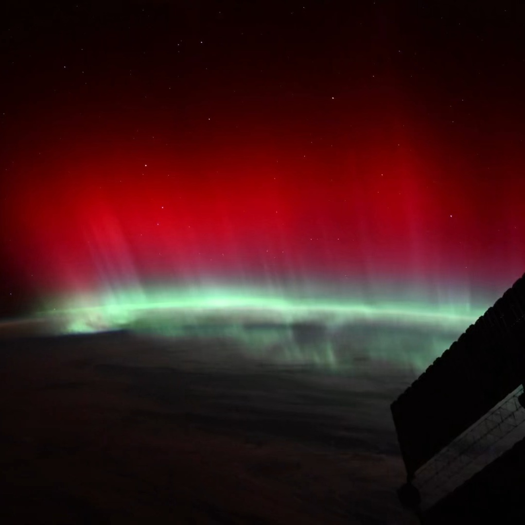 Instagram post by @astro_pettit for NASA. Caption reads: Red auroras of this size and vibrancy are rare,....