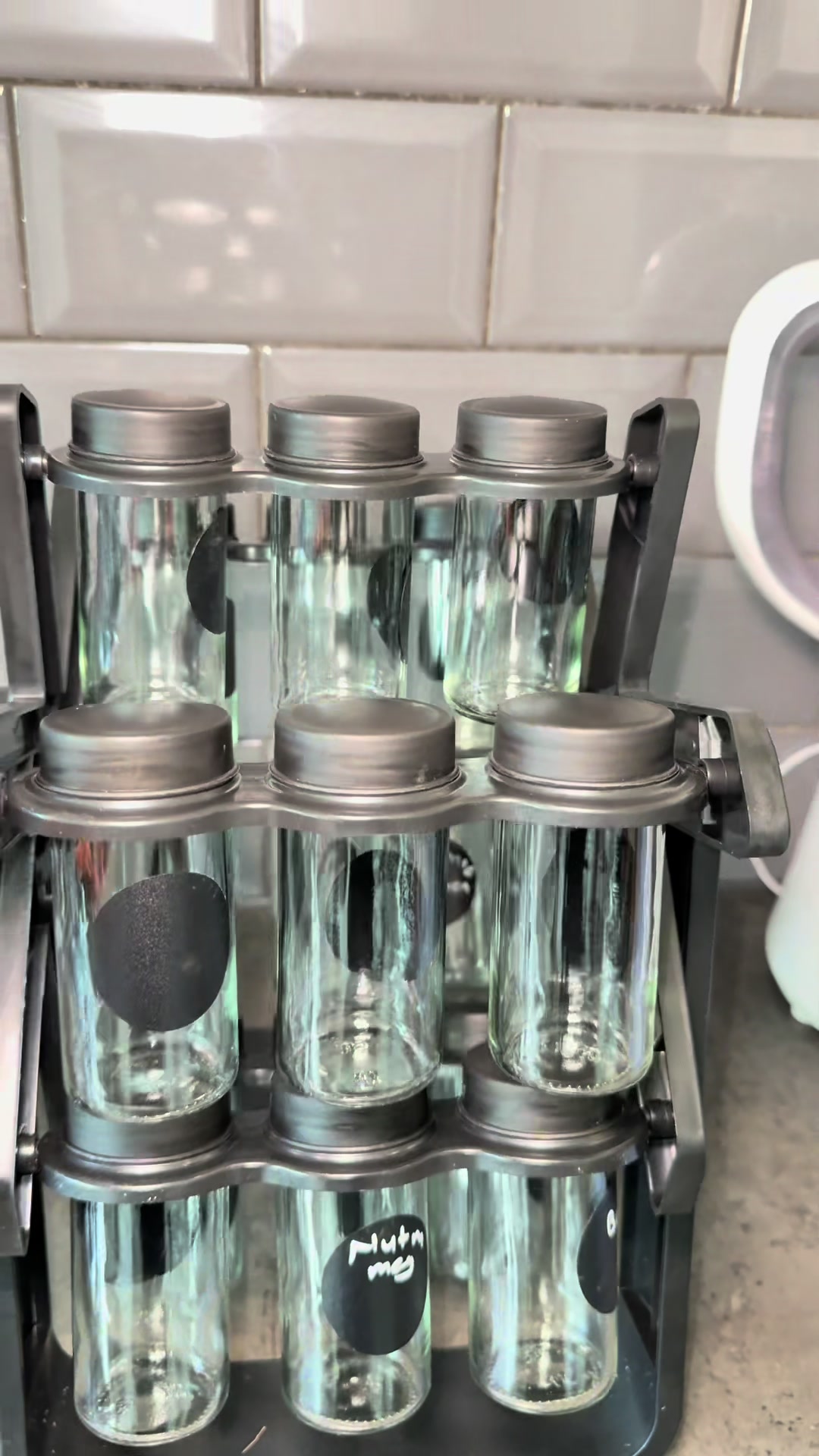 TikTok post by @luikitaana for Living and Home. Caption reads: Rack from @Livingandhome UK #spicesrackstorage.
