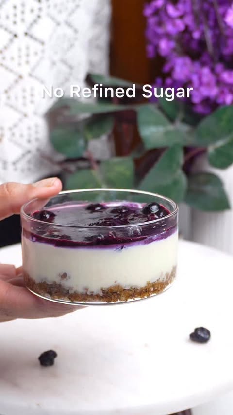 Instagram post by @thevegetarianladki for GRITZO. Caption reads: A no-bake blueberry cheesecake cup that looks like....