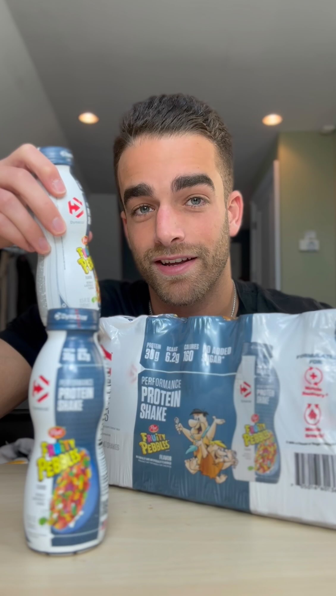 Instagram post by @maxandsnax_ for Dymatize. Caption reads: Trying Fruity Pebbles protein shake from @dymatize....