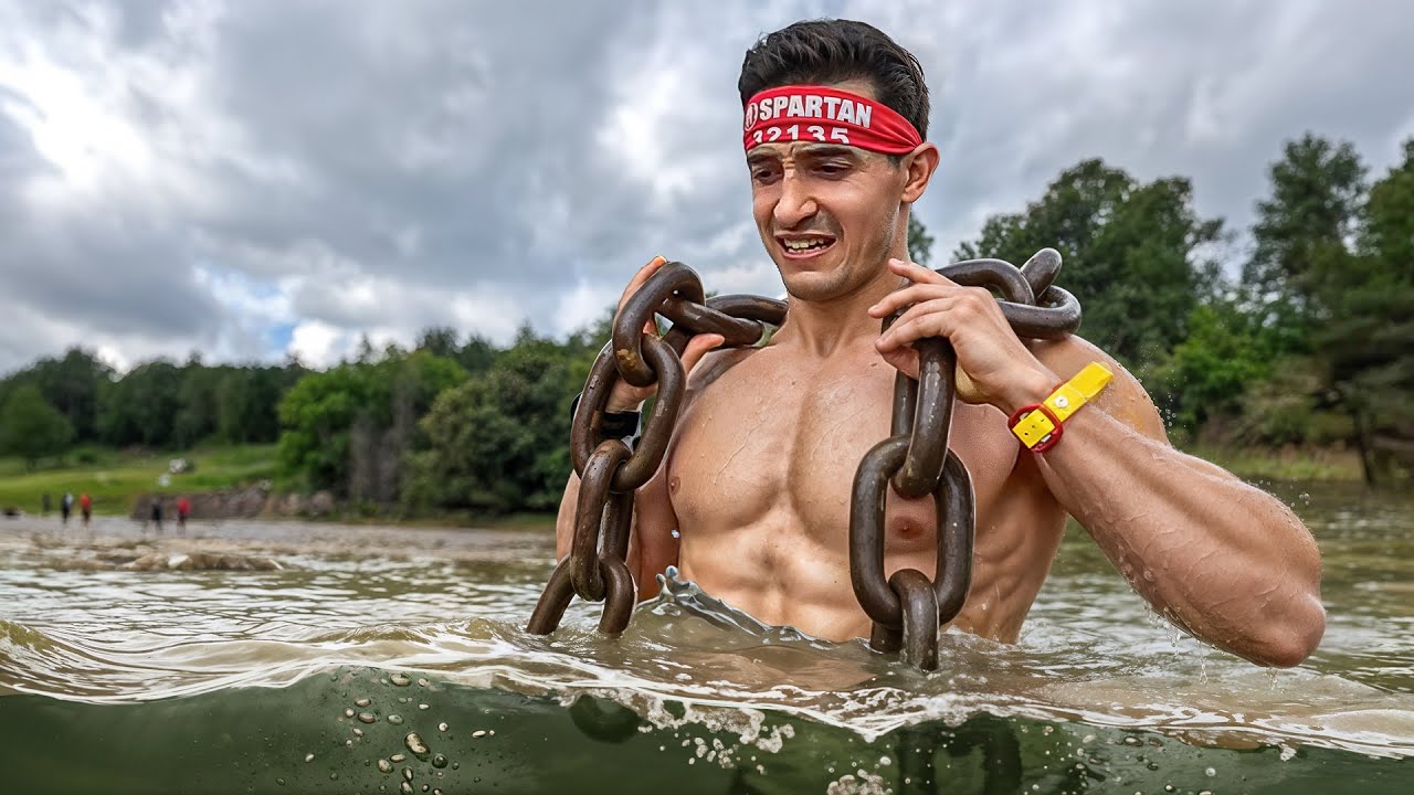 YouTube post by @TiboInShape for Shokz. Caption reads: THE TOUGHEST OBSTACLE RACE IN THE WORLD!! (Spartan....