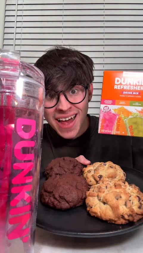 Instagram post by @caloriecarnage for Singles To Go. Caption reads: Let’s Eat Cookies x @dunkin @singlestogo 🤯🍪....