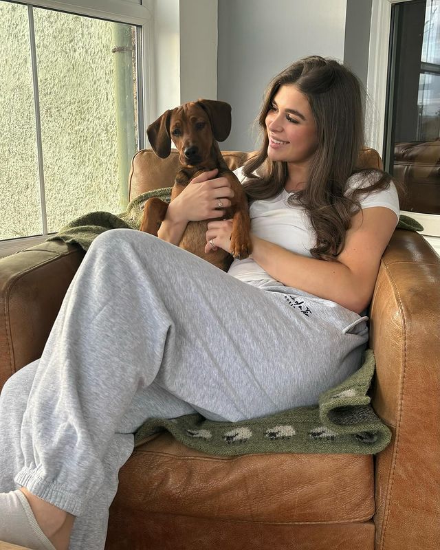 Instagram post by @thatbrunettefarmher for Whale Of A Time Clothing. Caption reads: Cosy Sundays 🐾 Wearing the new....