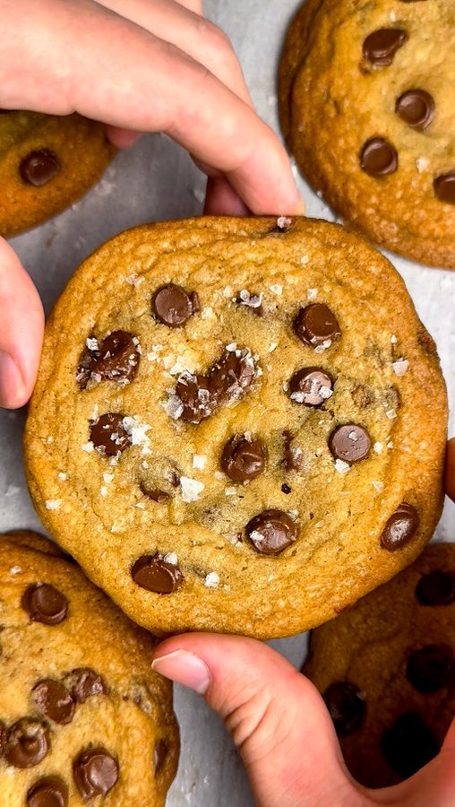 Instagram post by @recipeincaption for Amoretti. Caption reads: The BEST Brown Butter Chocolate Chip Cookies 🧈🍪....