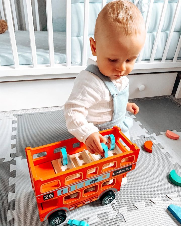 Instagram post by @mama.raising.three for Next Press. Caption reads: P L A Y I N G 🚌
——
#ad Mason absolutely loves....