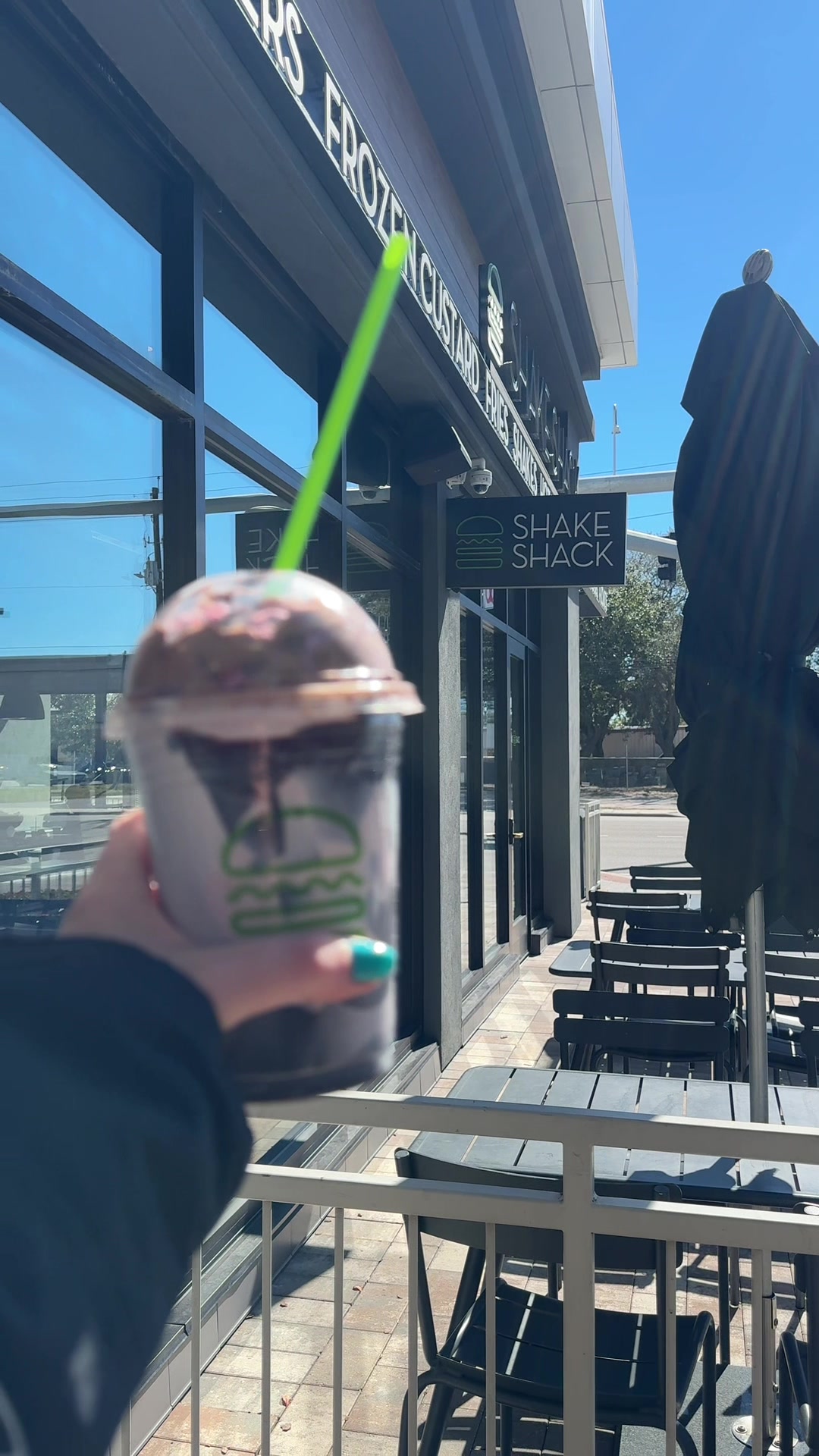 TikTok post by @sassy.massy for Shake Shack. Caption reads: [...] covered in chocolate! Obsessed! @shakeshack....