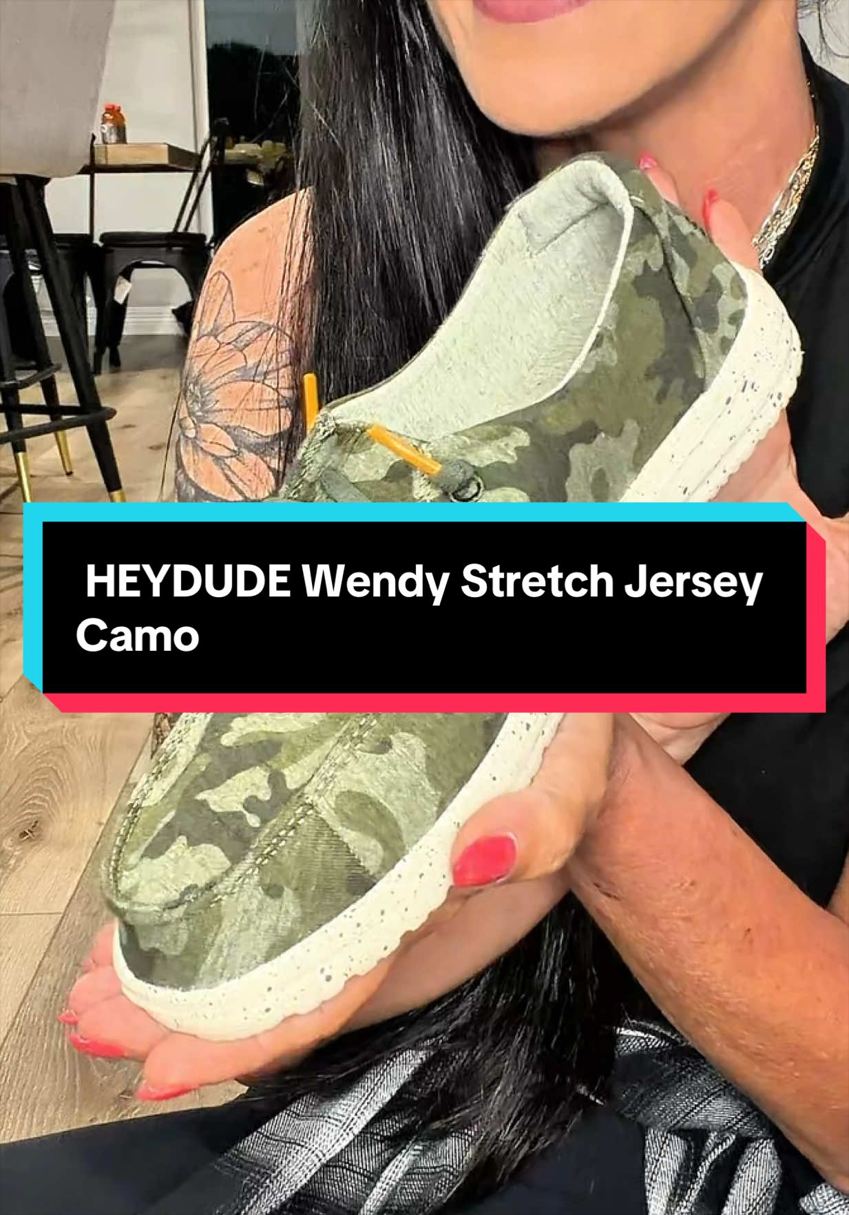 TikTok post by @mandirecommends for Hey Dude Shoes. Caption reads: HEYDUDE Wendy Stretch Jersey Camo -....
