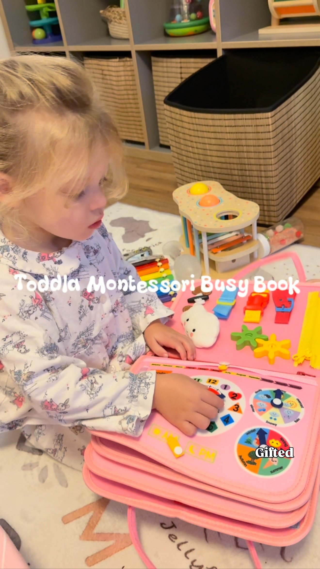 Instagram post by @ourwild.littleworld for Toddla. Caption reads: 🩵 TODDLA MONTESSORI BUSY BOOK 🩵 AD | we were....