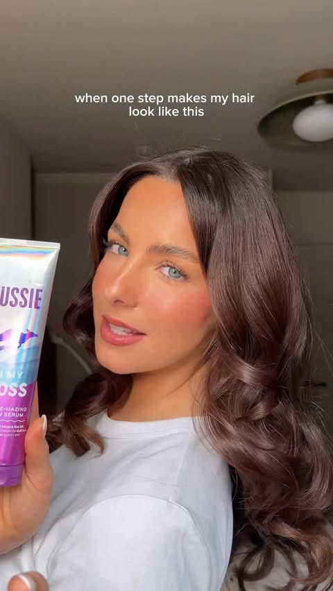 Instagram post by @abbimae_ for Aussie Hair. Caption reads: [...] literally reflect light, here it is.....