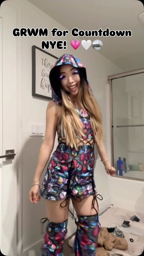 Instagram post by @thebabyrn for iHeartRaves. Caption reads: [...] fit before heading out 💗🤍 Fit by....