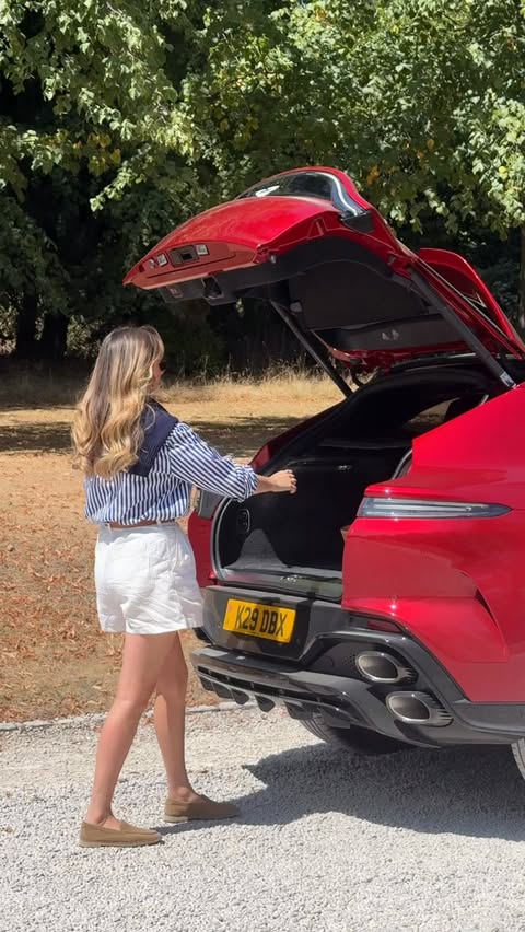 Instagram post by @georgiaphasey for Aston Martin. Caption reads: [...] I’m a passenger princess at heart)....