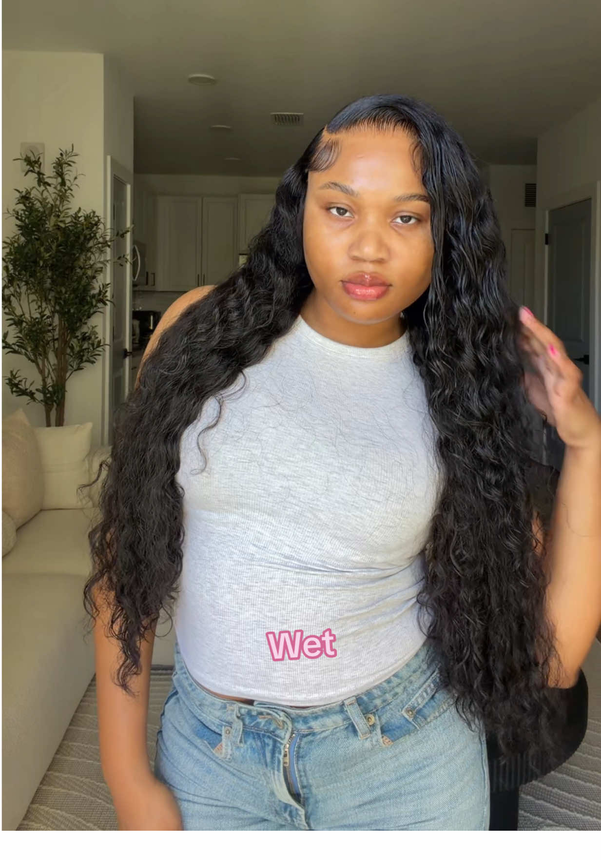TikTok post by @jayandnia for Wiggins Hair. Caption reads: These curls are everything 😍🔥 @wigginshairwig....