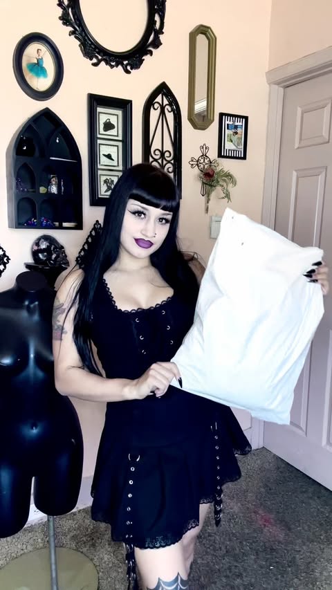 Instagram post by @sweet.madame.blue for Hot Topic. Caption reads: @hottopic Which one is your fav 🖤💜🖤 . [...].