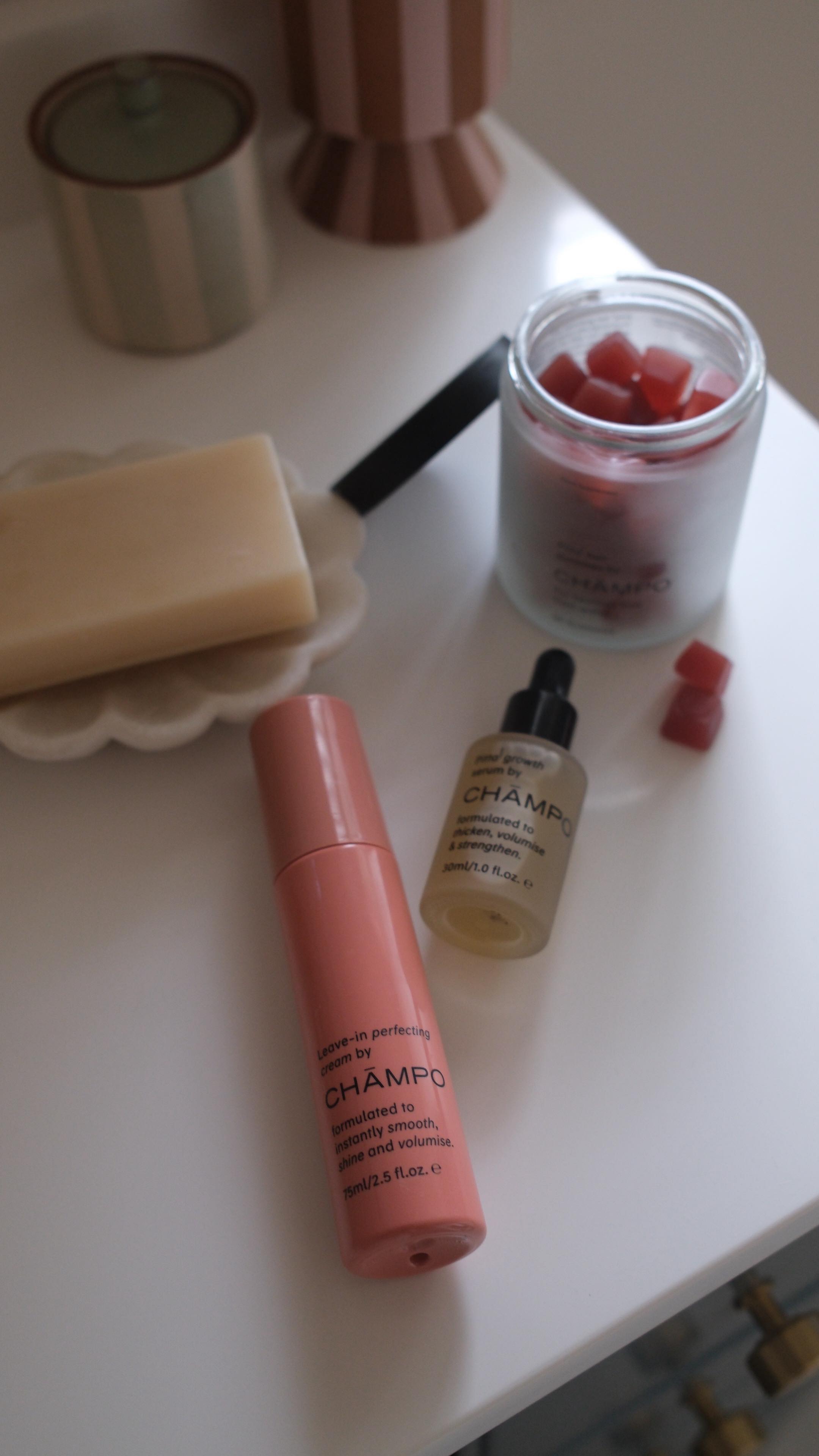 Instagram post by @carasuthers for Chāmpo Haircare. Caption reads: ad @champohaircare has been my hair non negotiable....