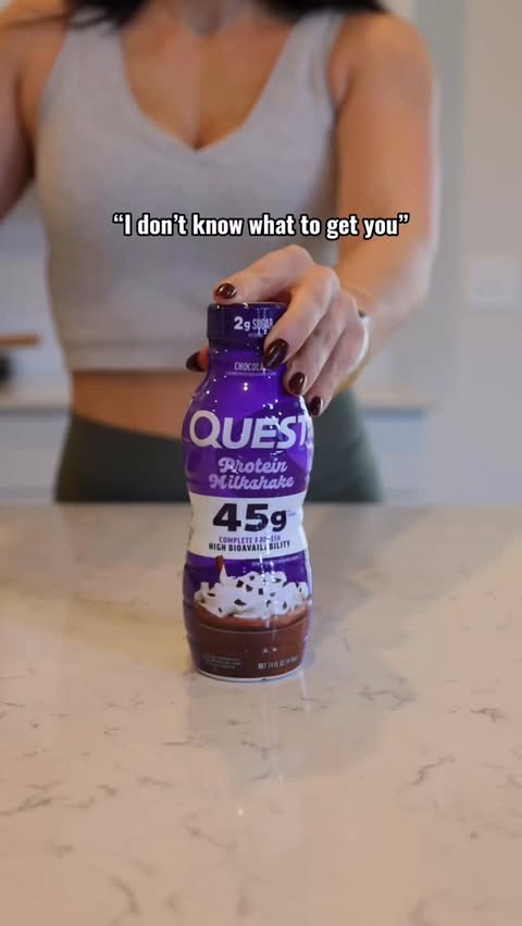 Instagram post by @karrah_peden_trammell for Quest Nutrition. Caption reads: Oh let me show you! 😜🎁🎄.