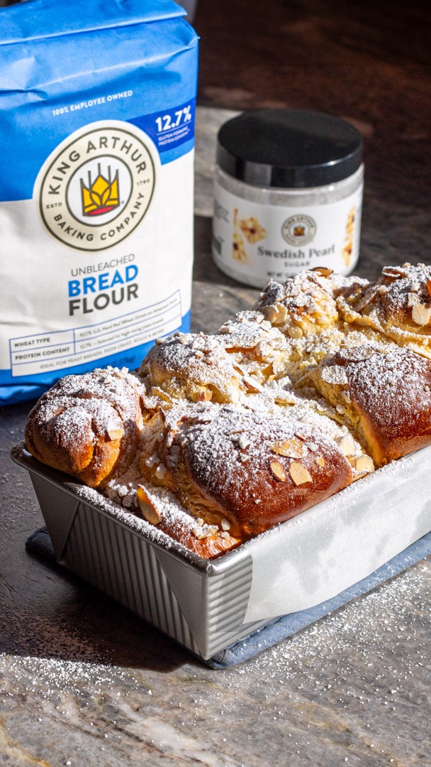 Instagram post by @kitchen_bythesea for King Arthur Baking Company. Caption reads: Almond Croissants meet Milk Bread for the ultimate....