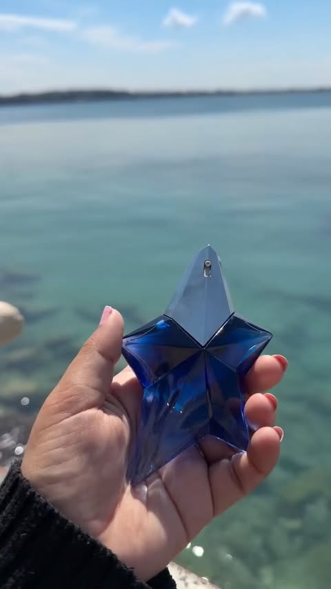 Instagram post by @the.realjassi for Mugler. Caption reads: [...] parfum looks like a fallen star? 🥹....