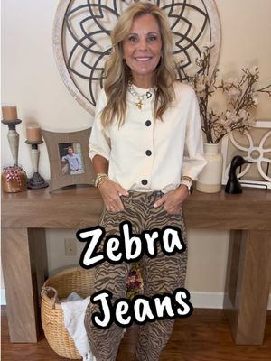 TikTok post by @stacieburnett for Imily Bela Official. Caption reads: Zebra is all the rage and these jeans are so cute!....