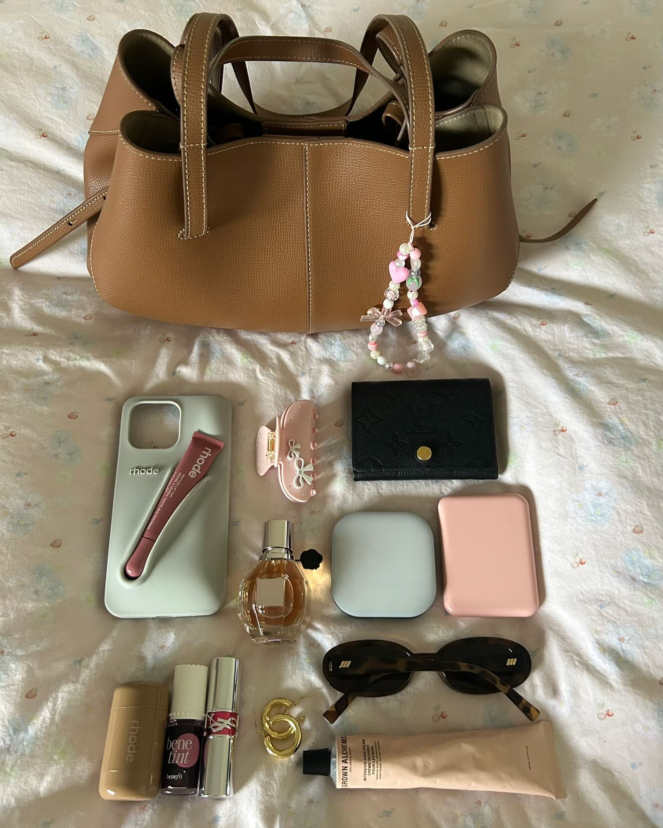 Instagram post by @carrieanne_ for Grown Alchemist. Caption reads: Tuesday bag picks 🎀👜🫶

@rhode*....