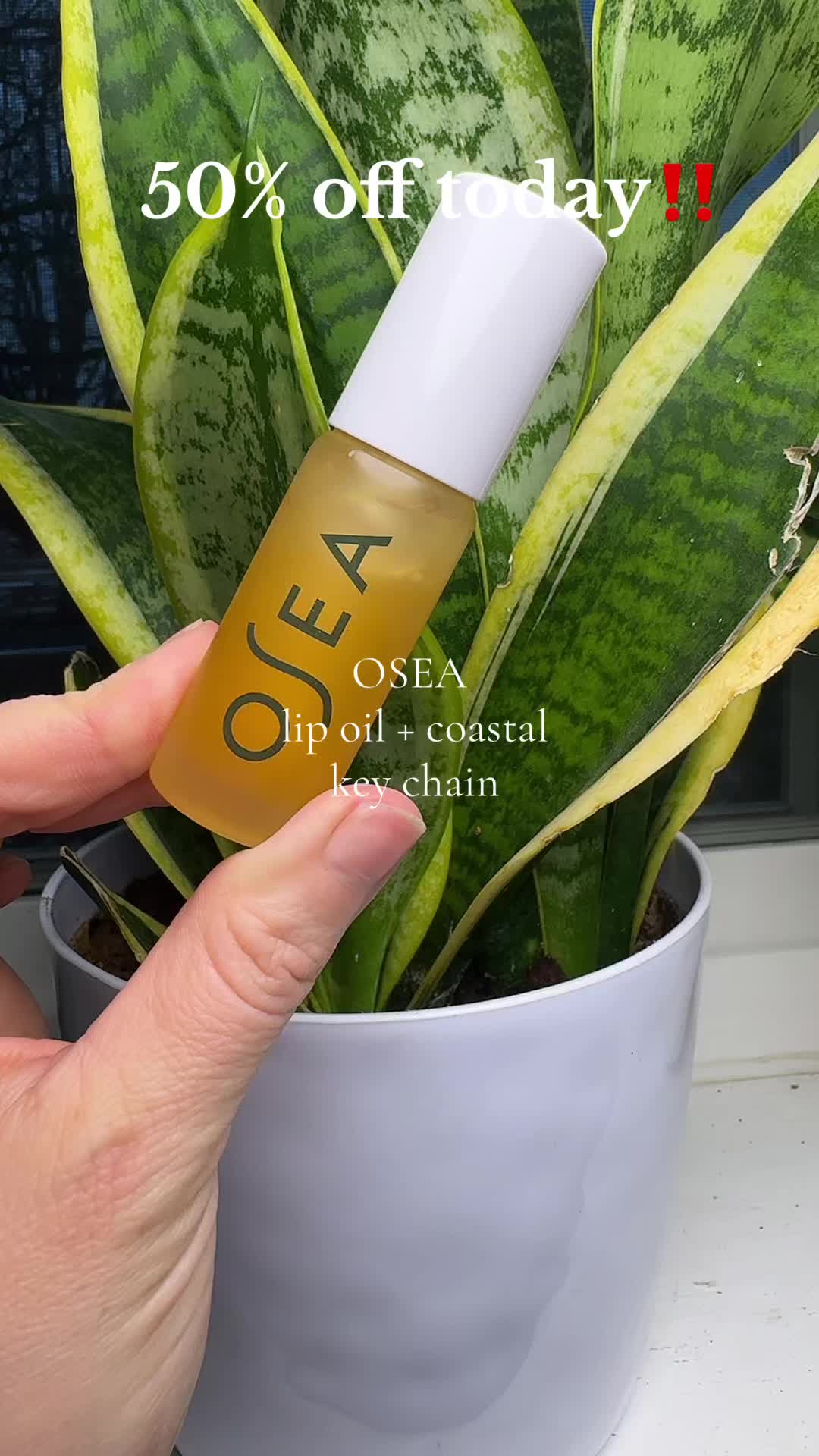 TikTok post by @shellkastle for OSEA Malibu. Caption reads: 50% off today!! @OSEA Malibu lip oil + key chain.....