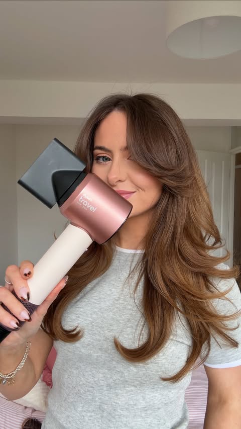 Instagram post by @mariajoynson for Dyson Beauty. Caption reads: Testing the NEW @dysonbeauty travel dryer ✈️💕....