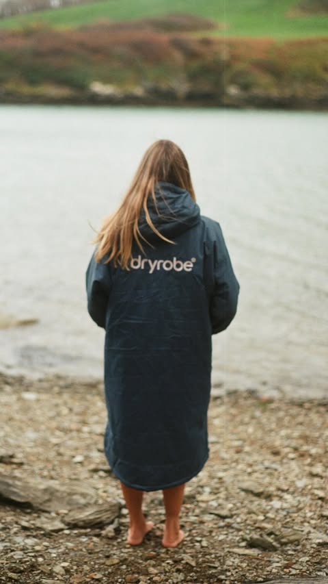 Instagram post by @skylaar.gracee for dryrobe. Caption reads: [...] the moment. 🌊 Luckily we have matching....