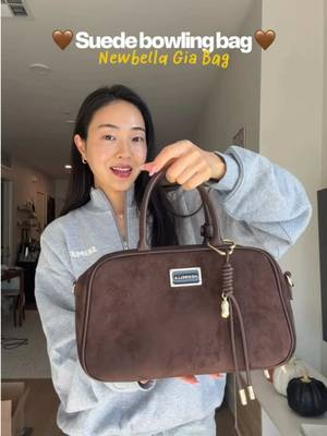 TikTok post by @clarahyee for Newbella Fashion. Caption reads: high quality suede & leather bag for under $100 🤎....